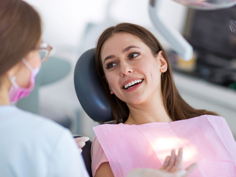 Young woman smiling in the dental chair.